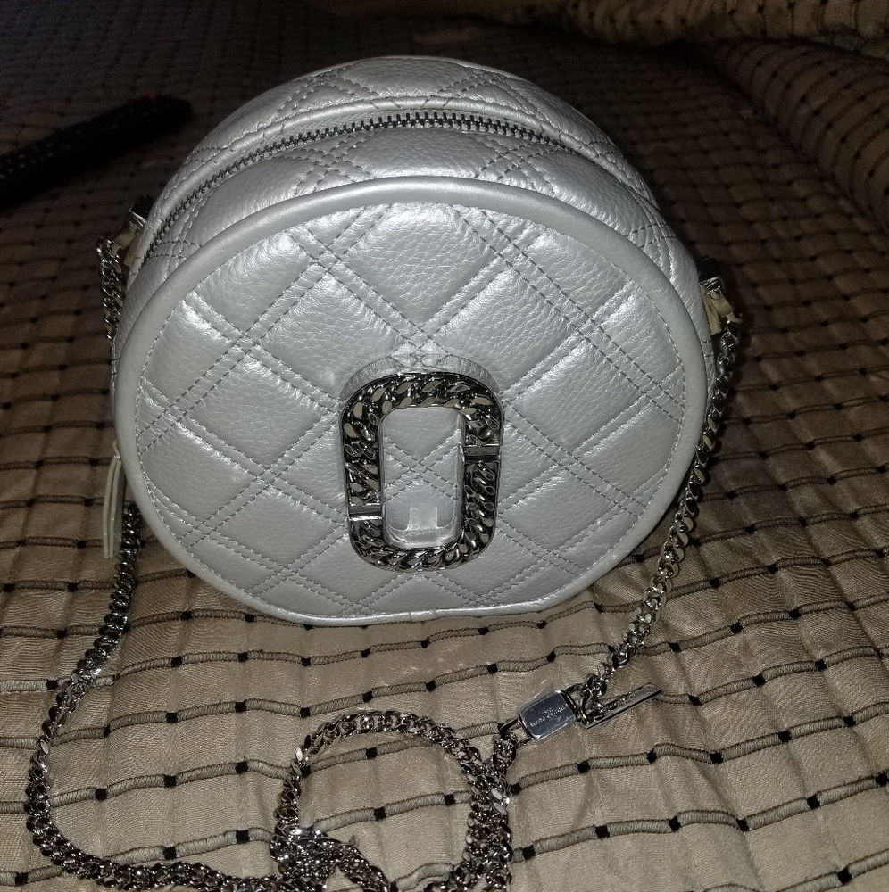 Marc Jacobs. The Metallic Status Round Quilted Leather cross body chain bag.
